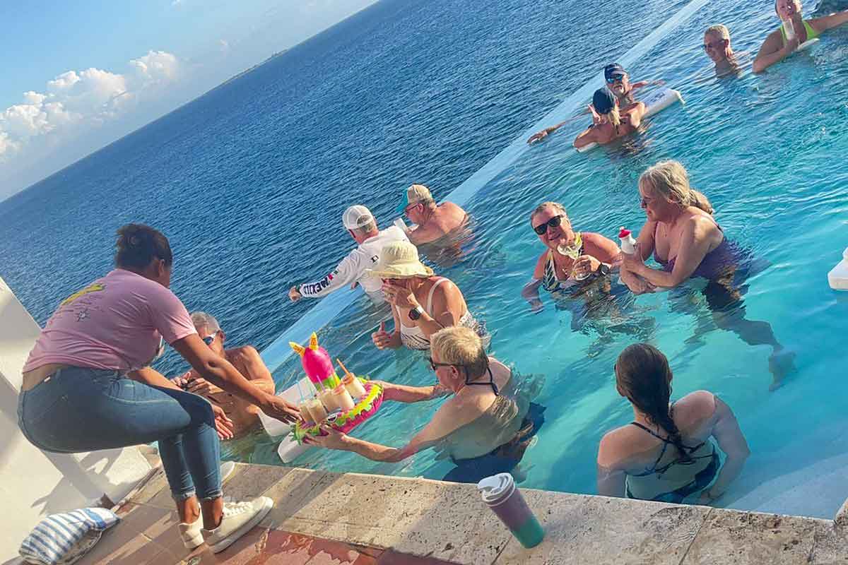 bartender delivering drinks to the pool